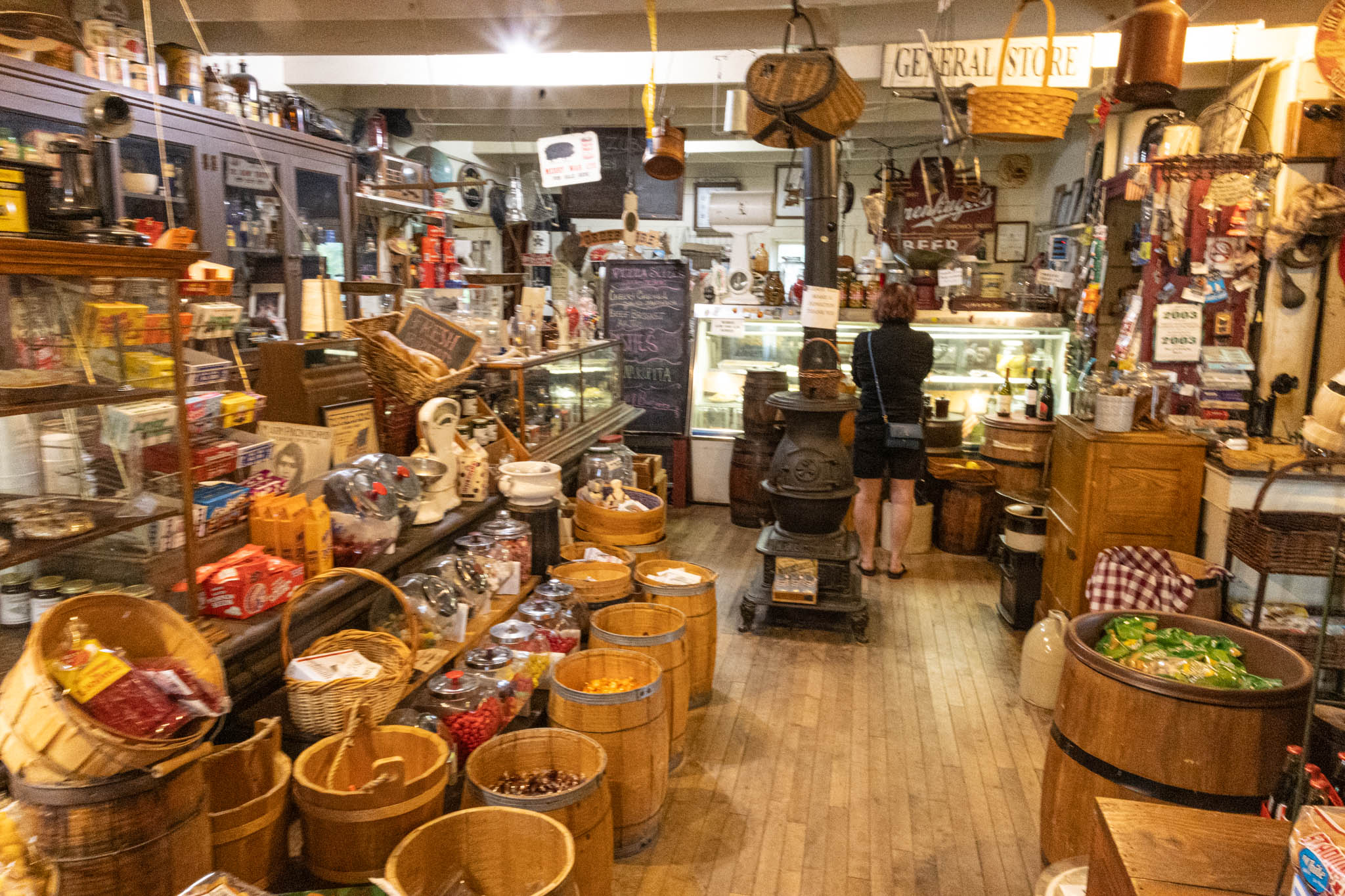 Inside the Old Mission General Store, with barrels of candy and a cast-iron stove