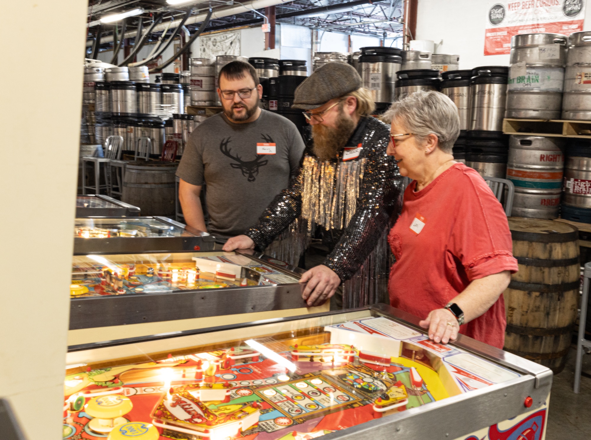 Brock Nummerdor playing pinball at Right Brain Brewery